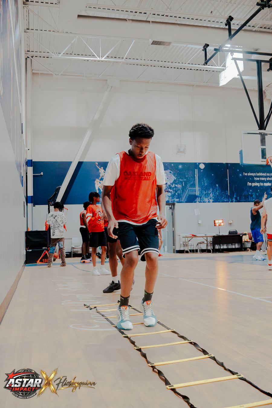 An athlete running a ladder footwork drill