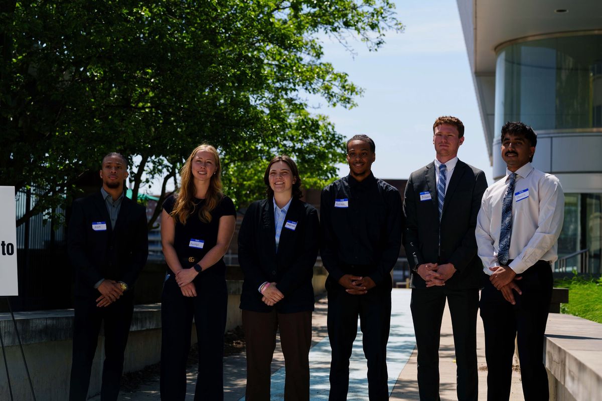 ASTAR members in business attire at an industry event